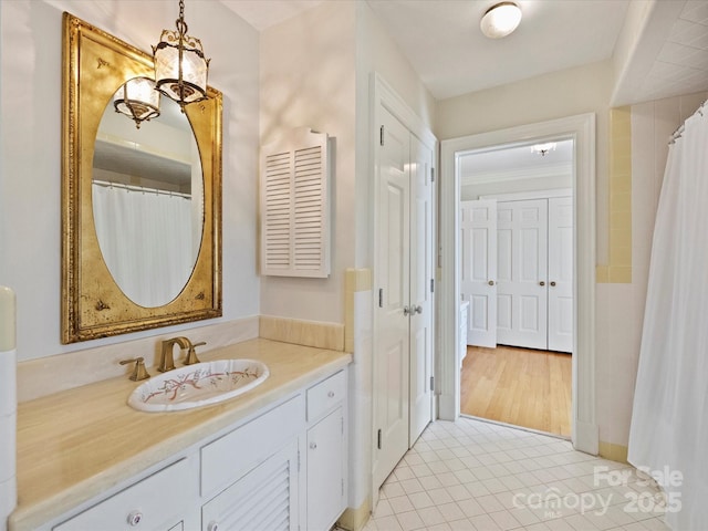 full bath featuring tile patterned flooring and vanity