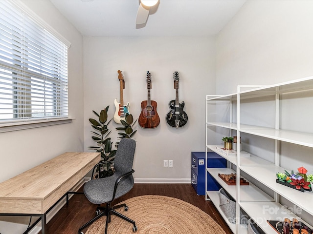 office space featuring dark wood-style floors, ceiling fan, and baseboards