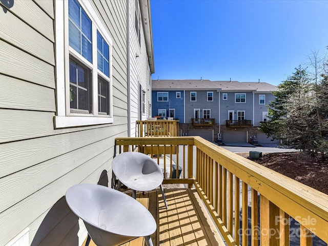 wooden deck featuring a residential view