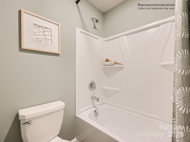 bathroom featuring shower / bathtub combination with curtain and toilet