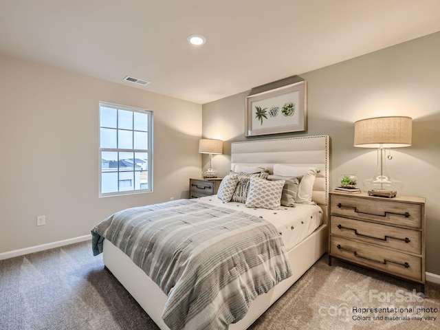 carpeted bedroom featuring baseboards, visible vents, and recessed lighting