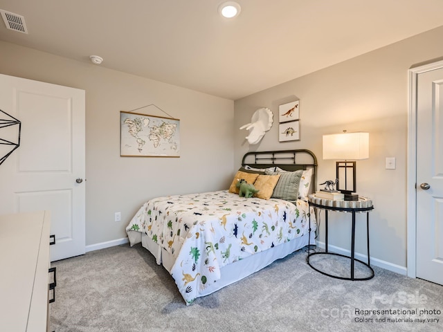 carpeted bedroom with baseboards and visible vents