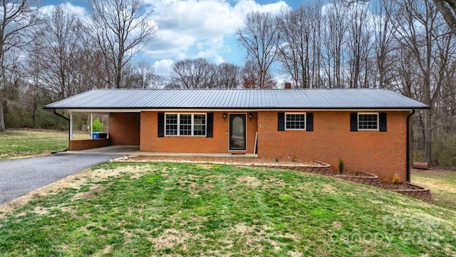 104 Pop Davis Rd, Taylorsville, NC 28681 - ranch-style house featuring brick siding, metal roof, asphalt driveway, and a front lawn
