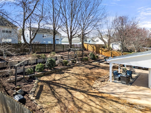 view of yard featuring fence private yard and a patio