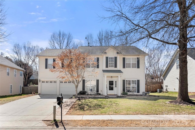 view of front of home with an attached garage, fence, a front lawn, and concrete driveway