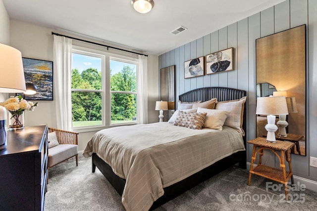 carpeted bedroom with baseboards and visible vents