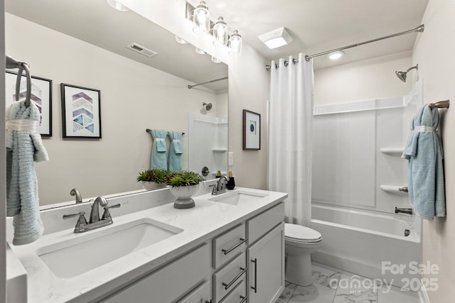 full bathroom featuring marble finish floor, shower / bath combo, visible vents, and a sink