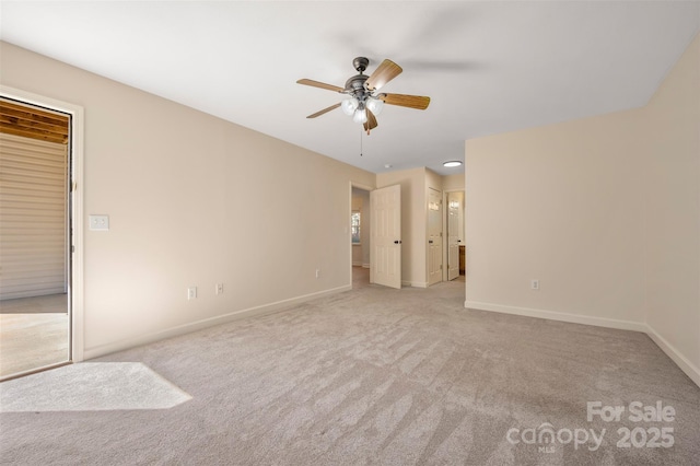 unfurnished bedroom featuring a ceiling fan, baseboards, carpet, and ensuite bathroom