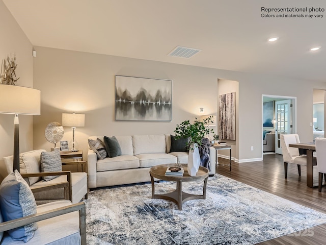 living room with recessed lighting, wood finished floors, visible vents, and baseboards