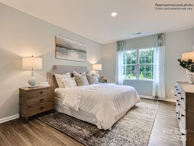 bedroom featuring recessed lighting, wood finished floors, visible vents, and baseboards