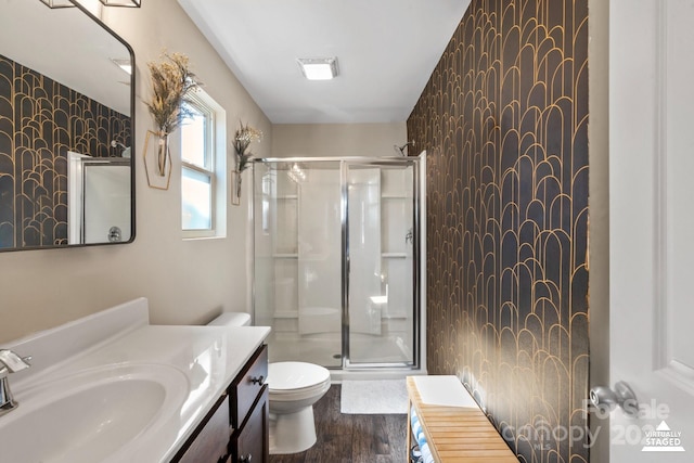 full bath featuring toilet, a stall shower, visible vents, and vanity