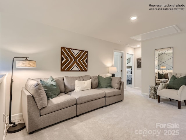 living room featuring baseboards, carpet flooring, attic access, and recessed lighting