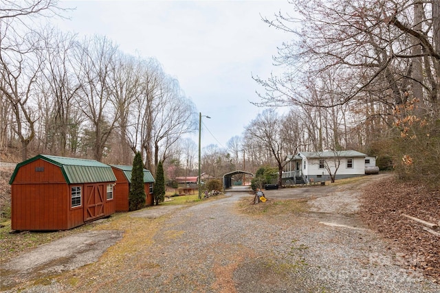 view of road with a barn