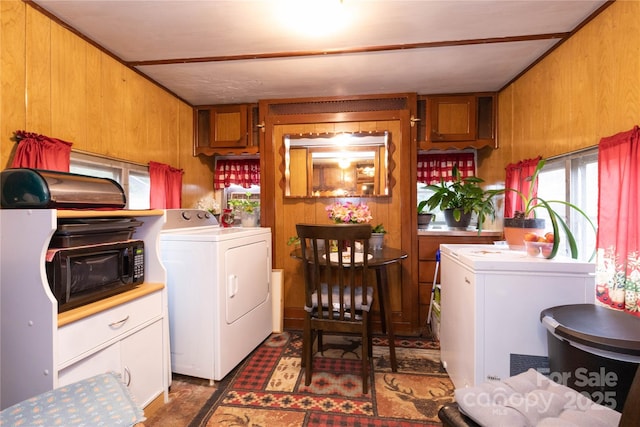 washroom featuring laundry area and wood walls