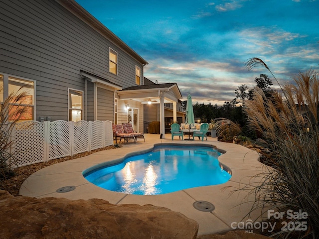 view of swimming pool featuring a fenced in pool and a patio area