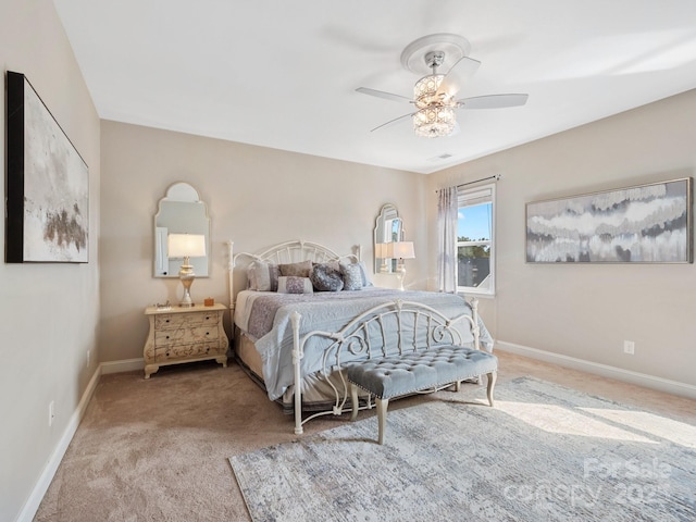 bedroom featuring baseboards, carpet, and a ceiling fan