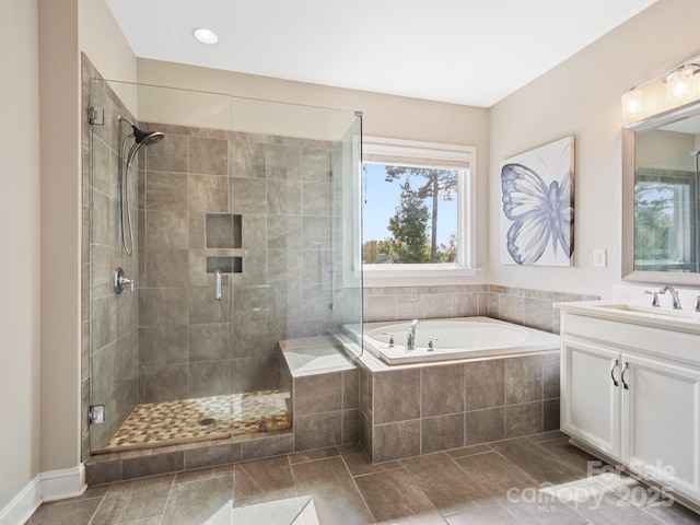 full bathroom with vanity, tile patterned floors, a bath, and a stall shower