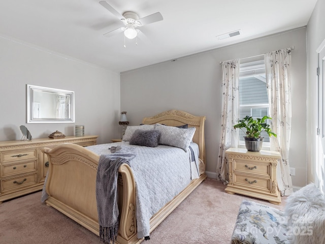 bedroom featuring light carpet, visible vents, baseboards, and ceiling fan