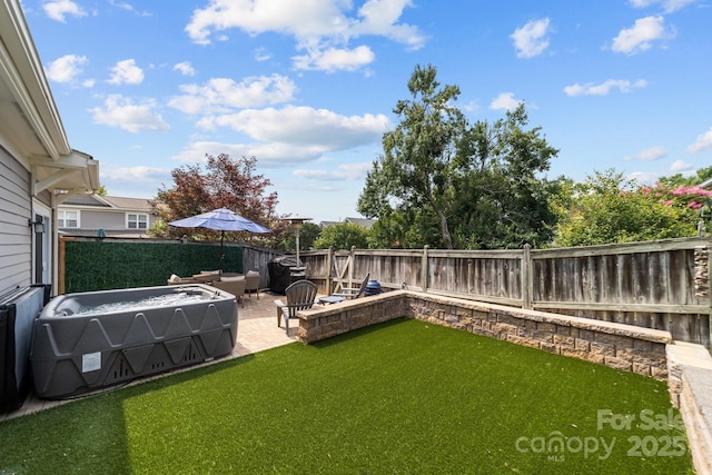 view of yard with a patio area and a fenced backyard