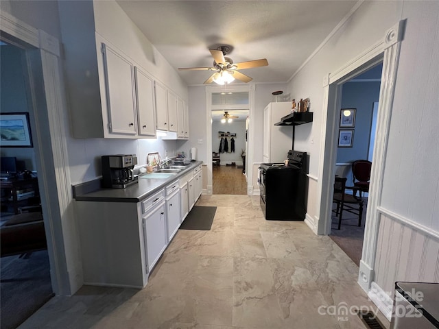 kitchen featuring ceiling fan, under cabinet range hood, electric range, and white cabinets