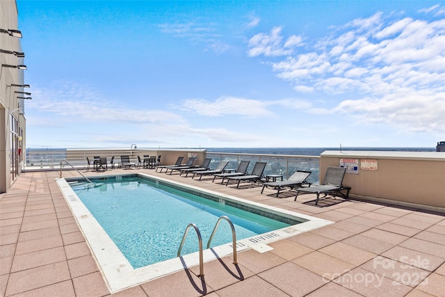 community pool with a patio area