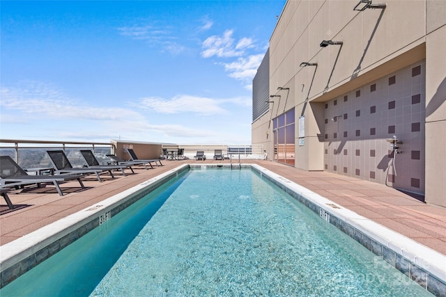 pool with a patio area