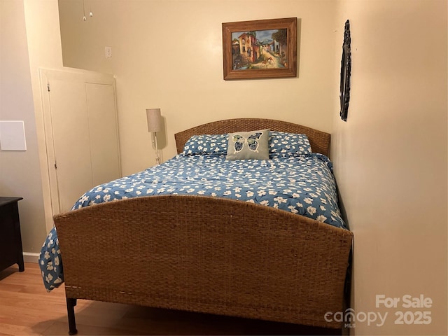 bedroom with wood finished floors