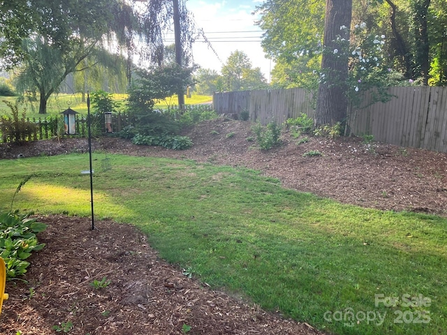 view of yard featuring fence