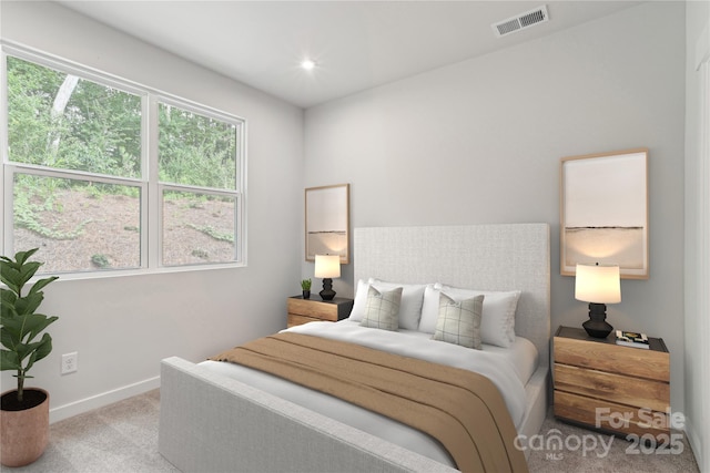 carpeted bedroom with recessed lighting, visible vents, and baseboards