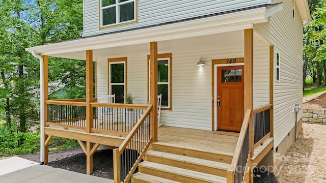 entrance to property featuring a porch