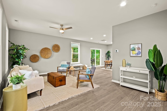 interior space with recessed lighting, visible vents, baseboards, and wood finished floors