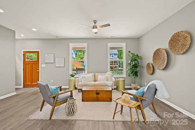 living room with ceiling fan, baseboards, wood finished floors, and recessed lighting