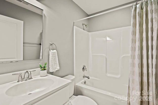 bathroom featuring shower / tub combo, visible vents, vanity, and toilet