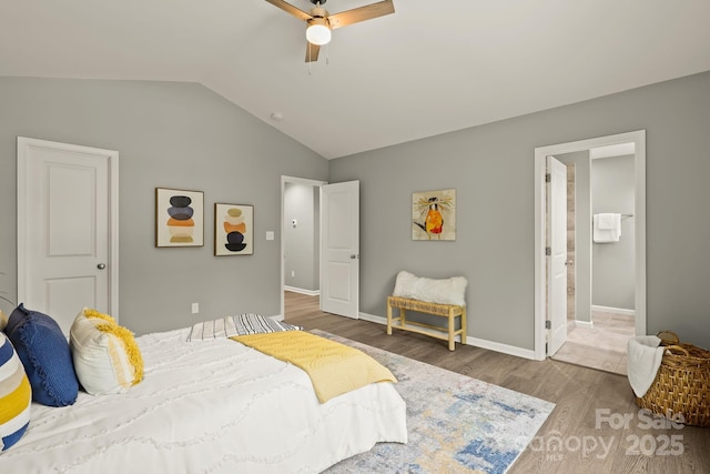 bedroom featuring lofted ceiling, wood finished floors, a ceiling fan, and baseboards