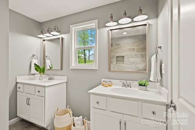 bathroom with two vanities and a sink