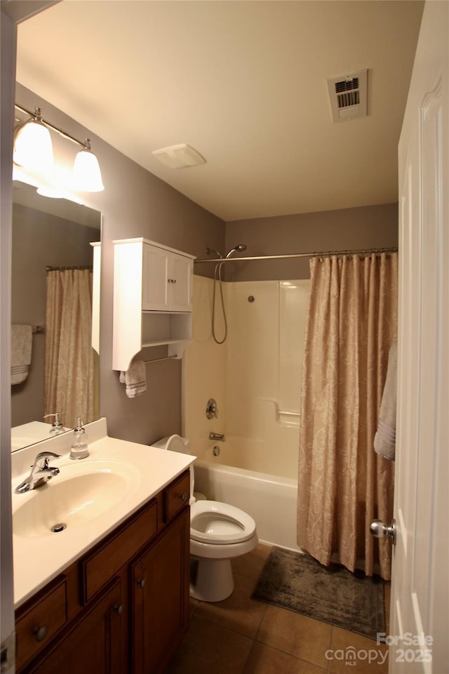 full bathroom with visible vents, toilet, shower / bath combo, vanity, and tile patterned flooring