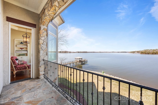 balcony featuring a water view