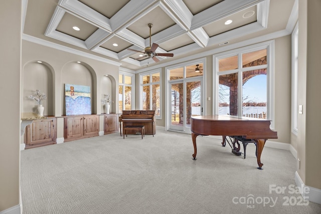 sitting room with crown molding, beamed ceiling, coffered ceiling, and light colored carpet