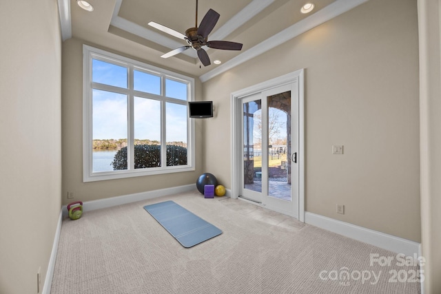 workout area featuring carpet, a raised ceiling, baseboards, and recessed lighting