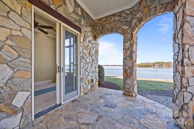 view of patio / terrace with a water view