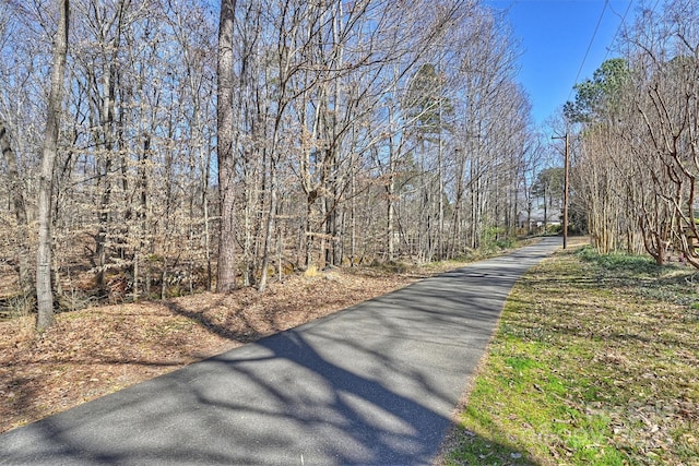 view of road featuring a view of trees