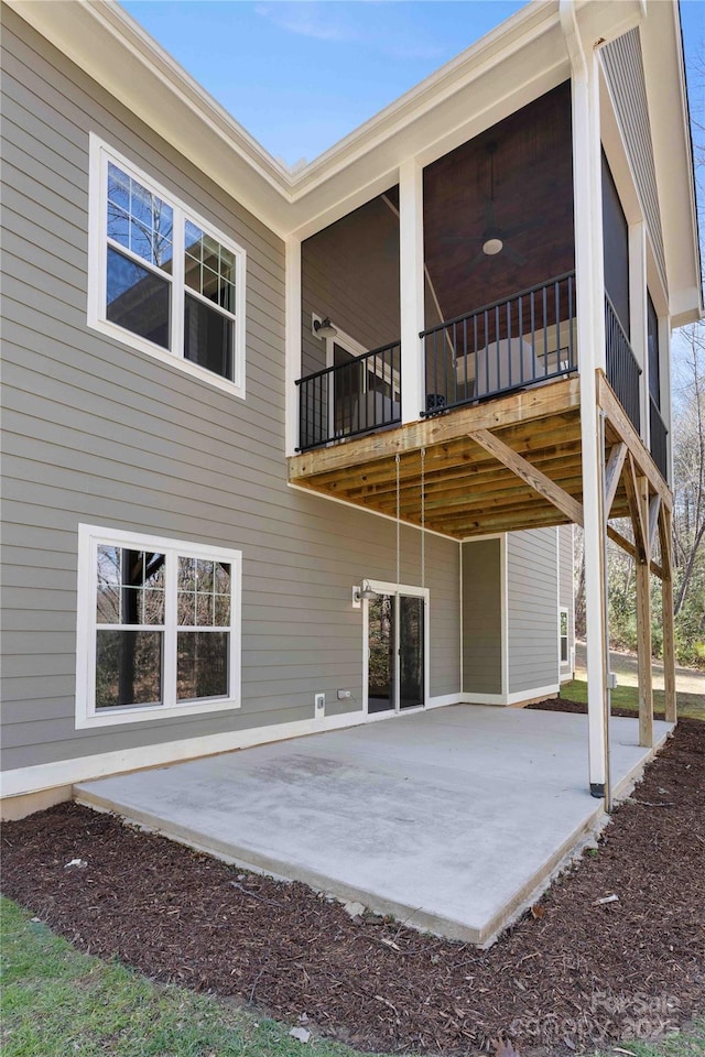 rear view of house featuring a patio