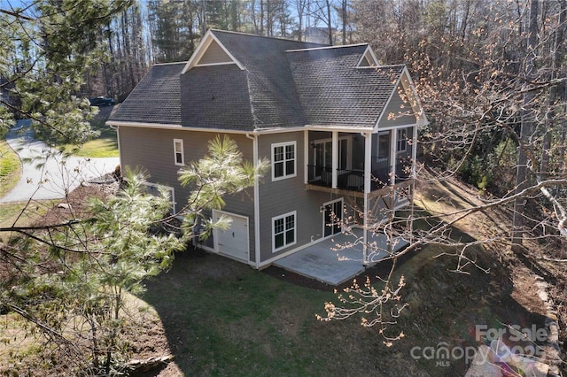 rear view of property with a patio area