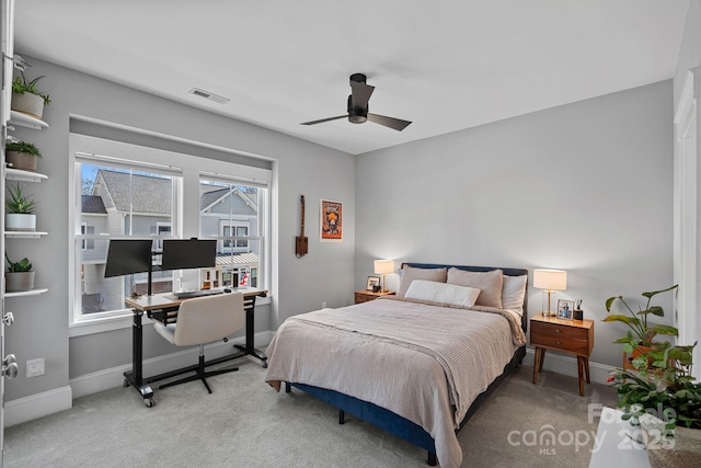 bedroom featuring visible vents, carpet flooring, a ceiling fan, and baseboards