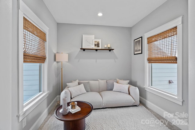 living room with recessed lighting and baseboards