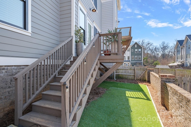 view of yard with stairway and fence