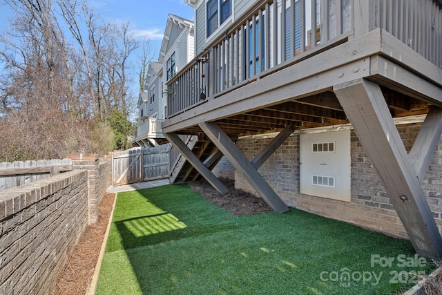 view of yard featuring a wooden deck and a fenced backyard