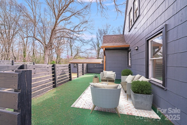 fenced backyard featuring an outdoor hangout area and a patio area