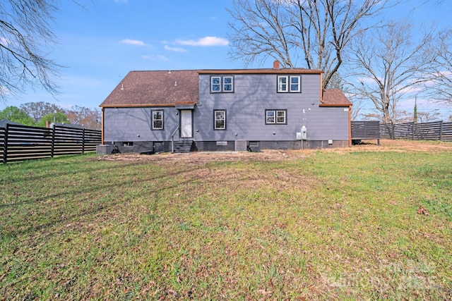 back of property with crawl space, entry steps, a chimney, and central air condition unit