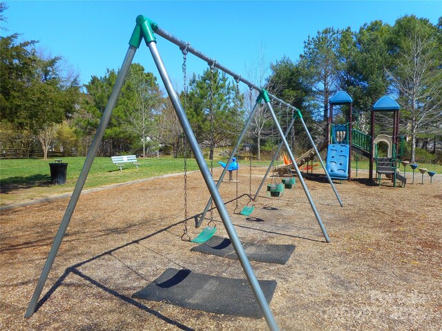 community jungle gym with a yard